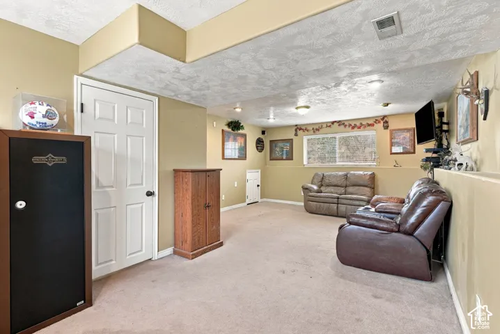 Finished lower level featuring recessed lighting, wall-to-wall carpeting, and a rectangular window