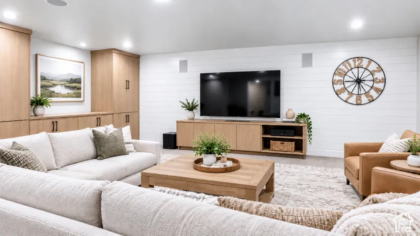 Custom built-in wood cabinetry, horizontal plank wall detailing, and recessed ceiling lighting