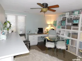 Room featuring wall-to-wall carpeting, a ceiling-mounted fan with light fixture, and horizontal window blinds