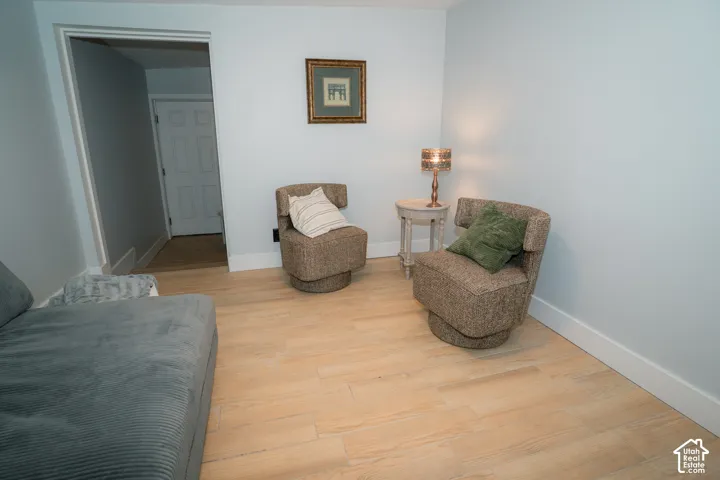 Neutral wall paint and light-toned wood-finish flooring