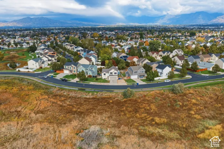 Aerial perspective featuring expansive mountain topography and open natural acreage