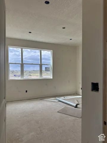 Interior space featuring expansive grid windows, recessed lighting, and neutral wall finishes