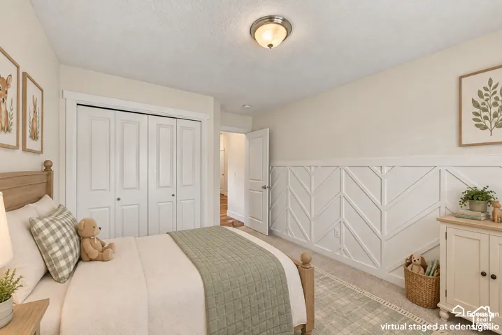 Interior space featuring white wainscoting with decorative herringbone paneling, four-panel folding closet doors, and a brushed nickel flush-mount ceiling light fixture