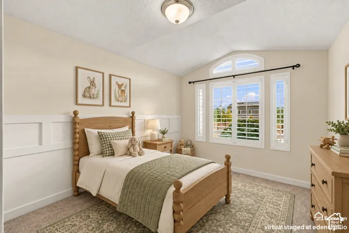 Vaulted ceiling, wall paneling, arched transom window, and interior shutters