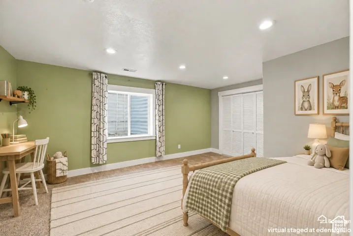 Neutral-toned carpeting, recessed lighting, double-door closet with louvered panels, and a slider window