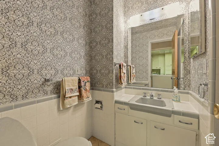 Main floor bathroom with shower off kitchen.