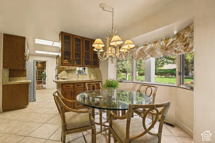 Kitchen dining area with view of nature and mountain views.