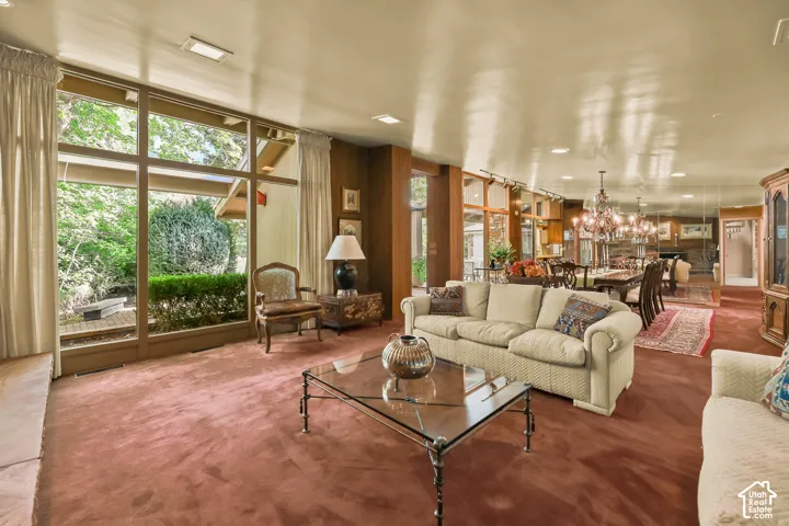 Living room with floor to ceiling windows.