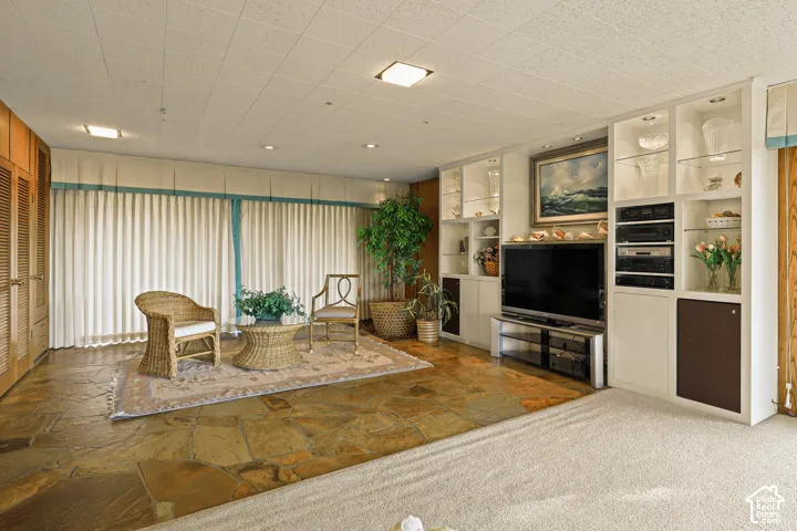 Natural stone flooring with beautiful built in shelving.