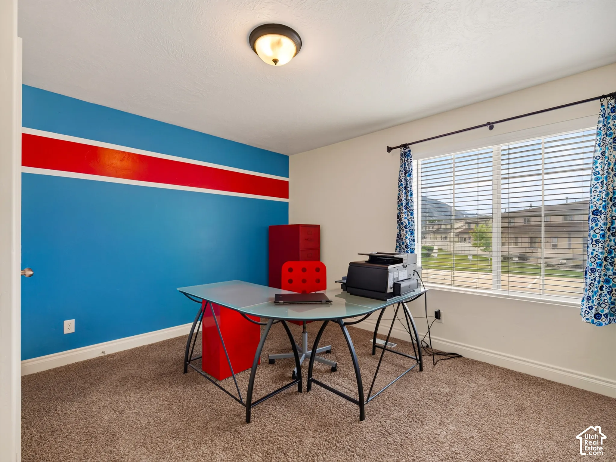 Room featuring wall-to-wall carpeting, a dual-pane window with horizontal blinds, and a dome-style ceiling light fixture
