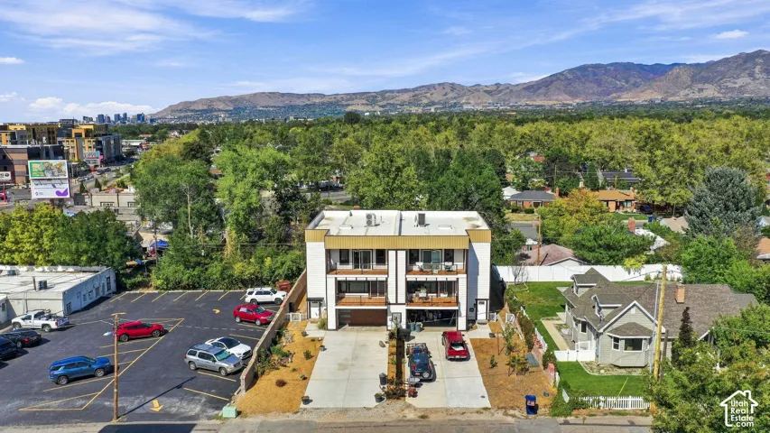 Modern multi-level architecture featuring a flat roofline and multi-toned exterior