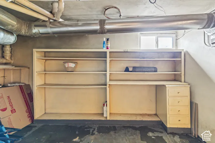 Built-in shelving unit featuring integrated storage drawers and open display surfaces