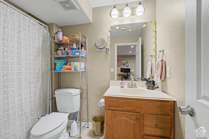 White vanity countertop with an integrated sink and chrome faucet