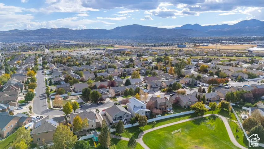 Neighborhood setting with established residential properties, mountain backdrop, and green spaces