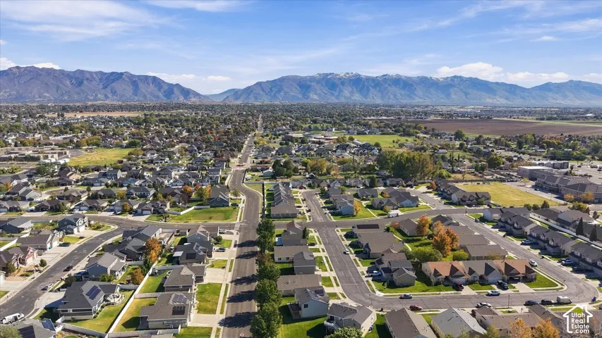 Aerial perspective featuring residential neighborhood surroundings with prominent mountain backdrop
