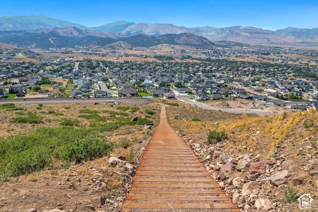 Hillside staircase featuring wood-plank treads with mountain and valley scenery