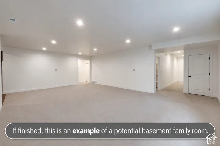Finished interior space featuring neutral wall-to-wall carpeting, recessed ceiling lighting, and crisp white interior doors