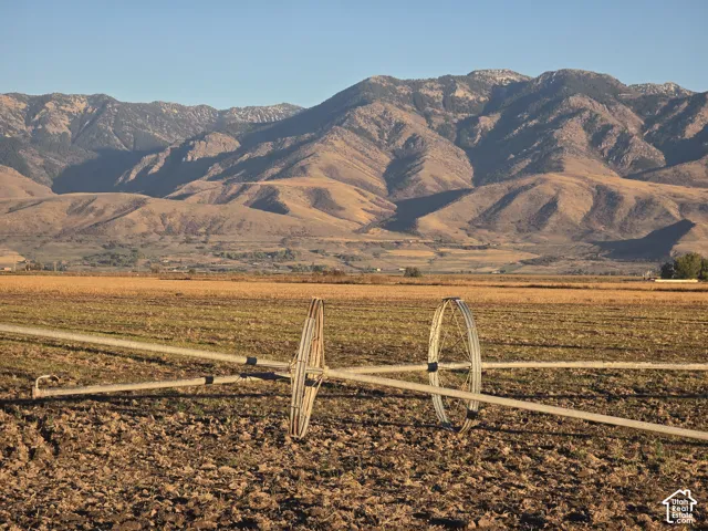Expansive acreage featuring prominent mountain backdrop and metal irrigation equipment
