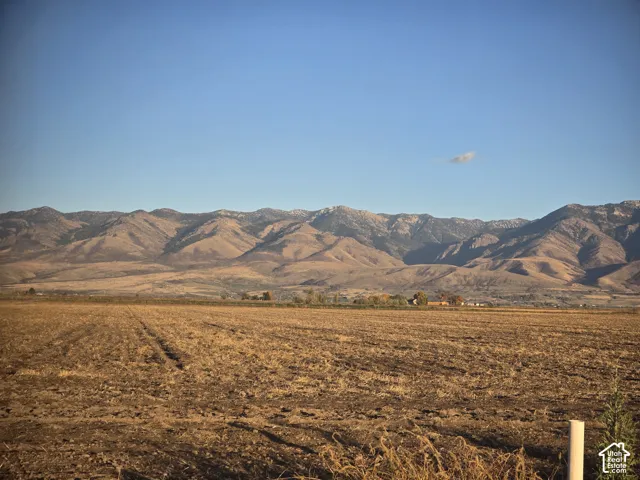 Expansive acreage featuring prominent mountain range surroundings