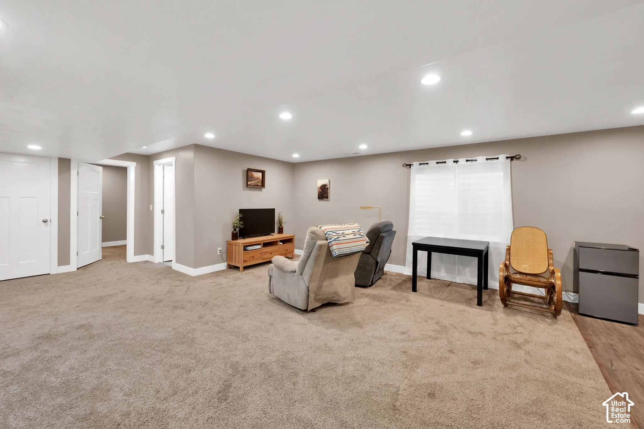 Neutral-toned interior featuring recessed ceiling lighting, wall-to-wall carpeting, and white interior doors