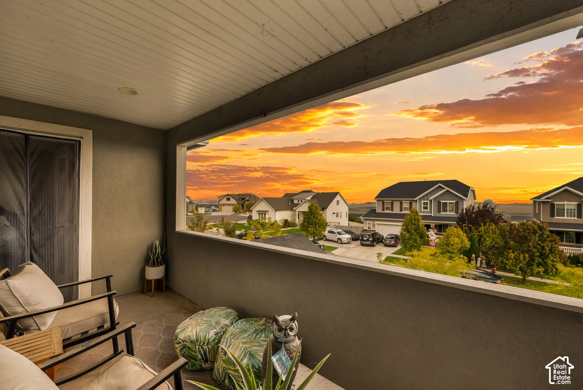 Covered balcony featuring a solid surface floor, neutral walls, and a recessed ceiling light