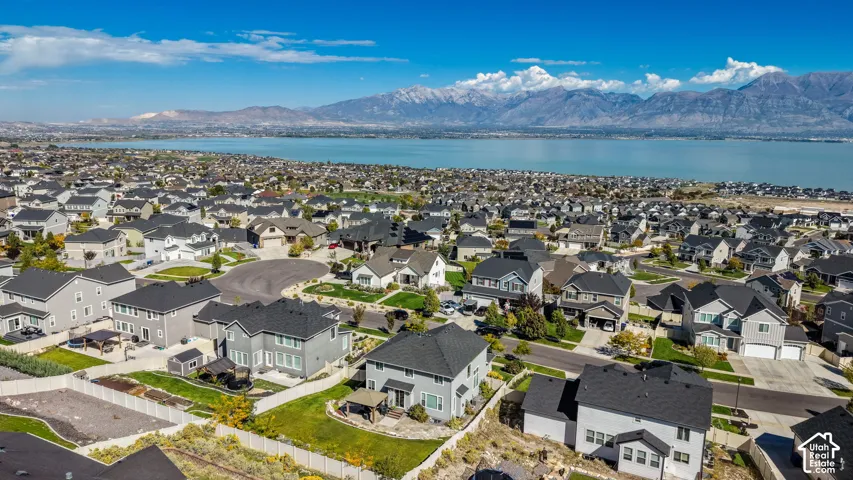 Aerial perspective featuring prominent mountain backdrops and expansive water scenery