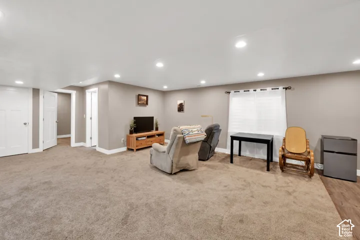 Neutral-toned interior featuring recessed ceiling lighting, wall-to-wall carpeting, and white interior doors