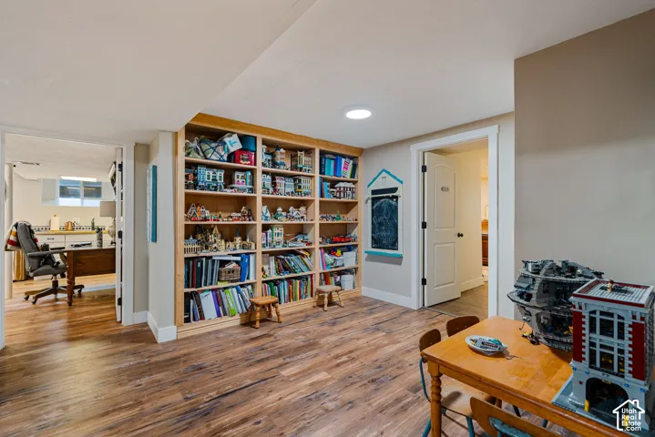 Built-in wood shelving, wood-finish flooring, and multi-panel interior doors