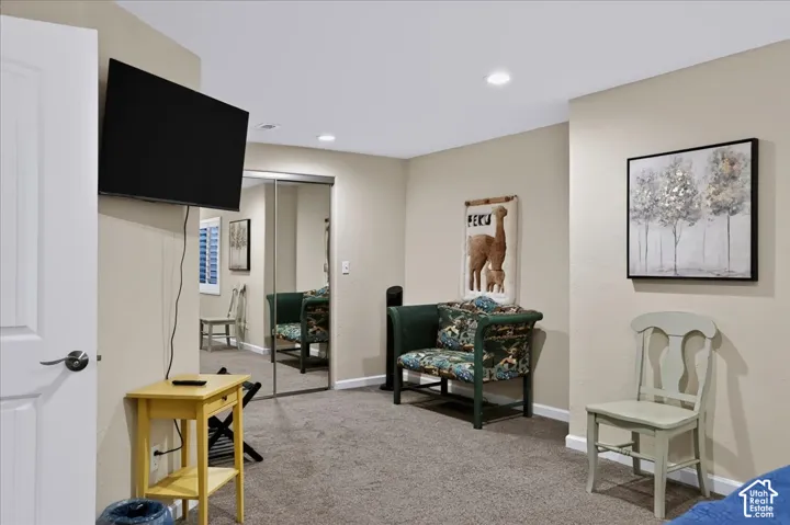 Room featuring recessed lighting, wall-to-wall carpeting, and sliding-mirror closet doors