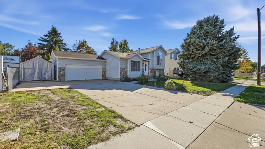 Front of the house featuring 2 car garage and spacious RV pad