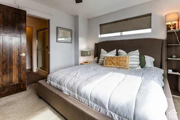 Solid wood-finish interior door, integrated floating shelving, and window with cellular shade