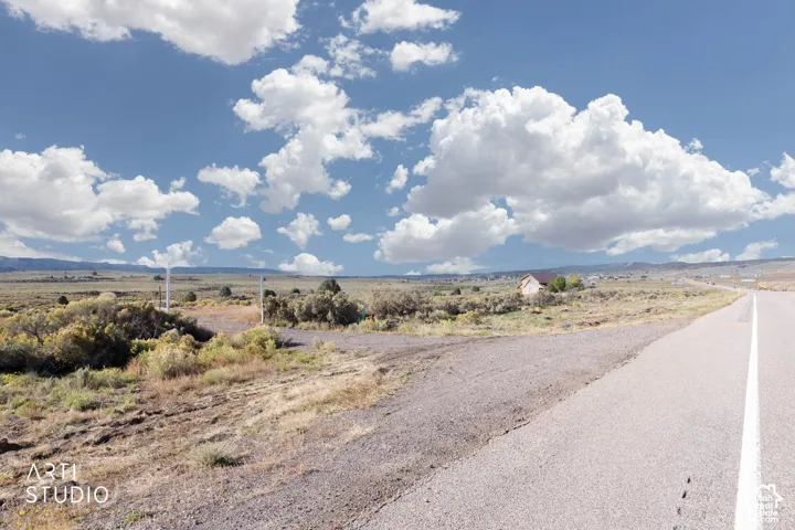 Expansive acreage featuring native high-desert vegetation, unimproved terrain, and mountain backdrop