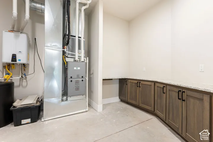 Built-in cabinetry with wood-finish doors and black hardware