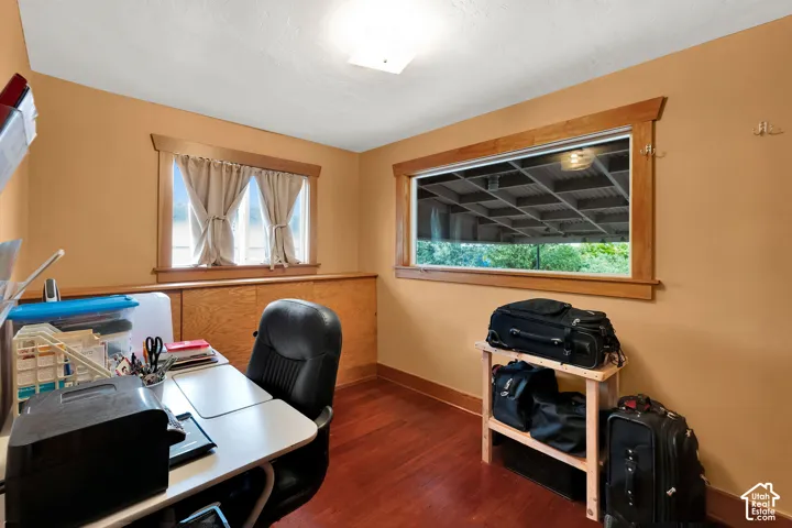 Wood-finish flooring, natural wood window trim, and built-in wooden cabinetry