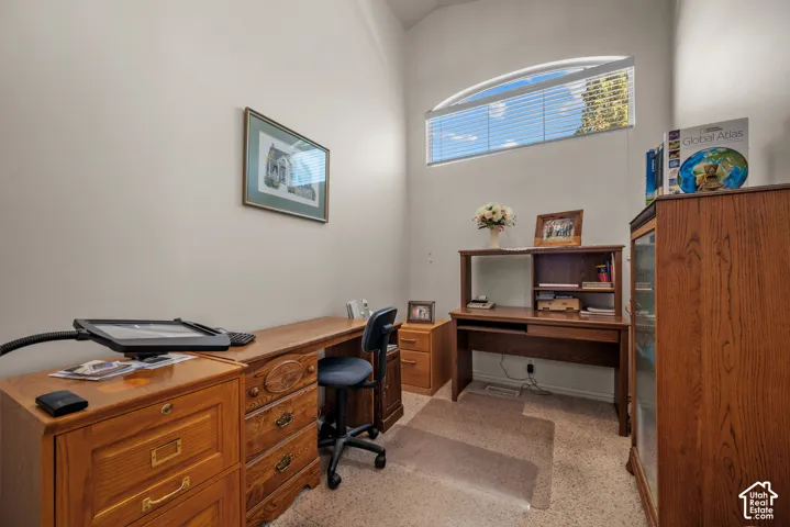 Vaulted ceiling featuring an arched transom window