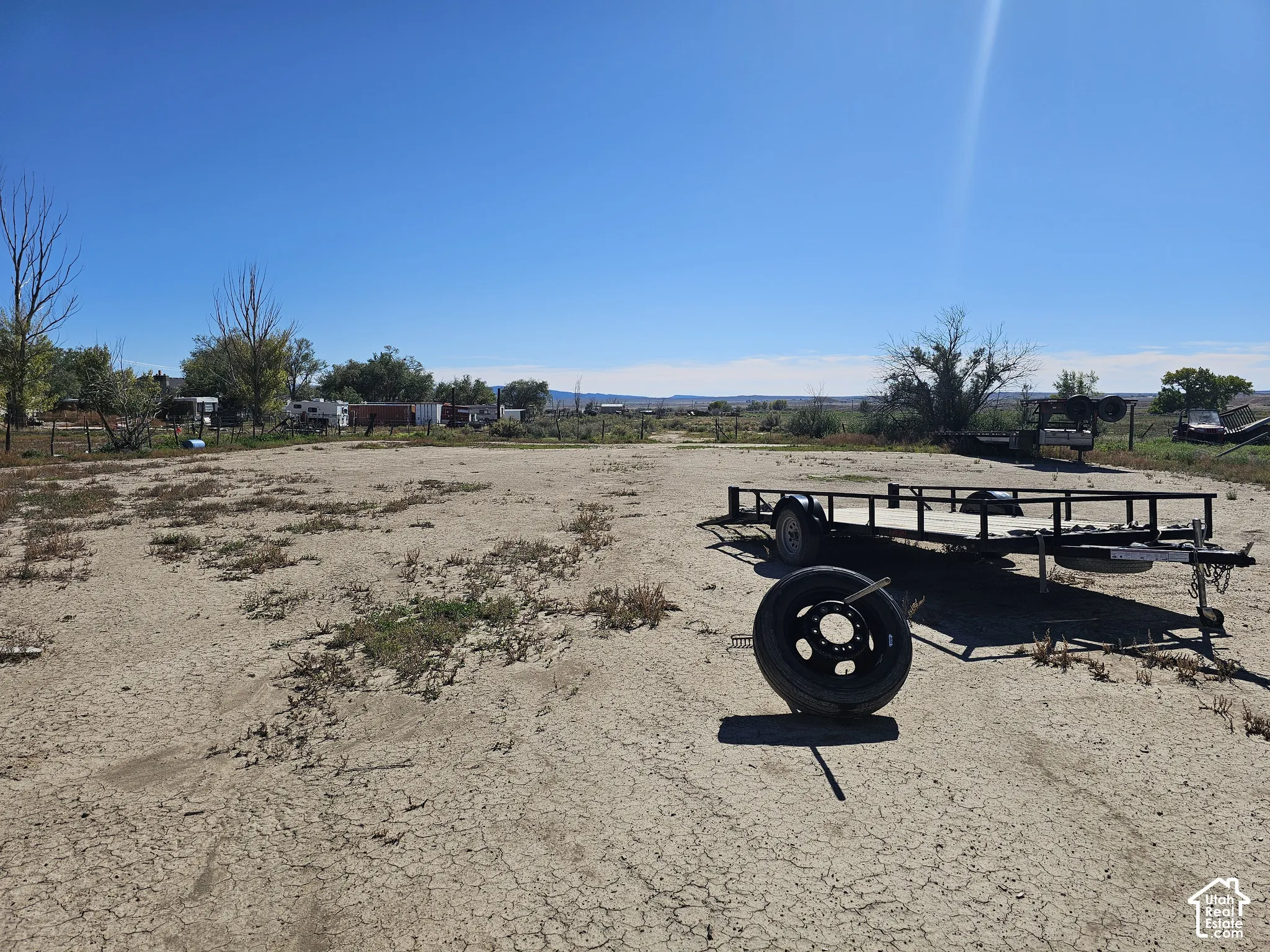 Expansive open-lot parcel featuring level terrain and mature trees