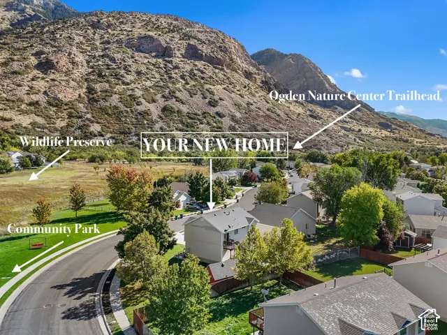 Nestled at the base of the mountains, this home sits across from a community park and wildlife preserve, with the Ogden Nature Center Trailhead just up the street.