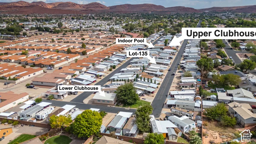 Aerial perspective featuring proximity to upper and lower clubhouses, an indoor pool, and red rock mountain scenery