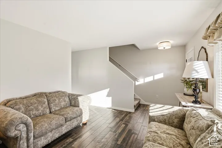 Wood-finish flooring, neutral wall tones, and recessed ceiling lighting