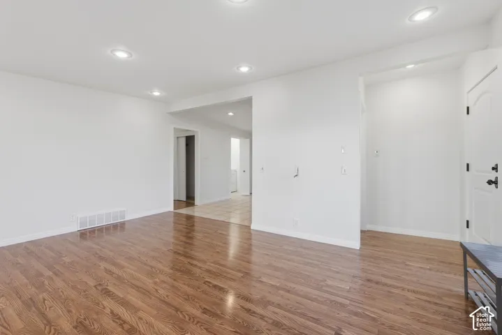 Interior space featuring wood-finish flooring, recessed lighting, and tile flooring