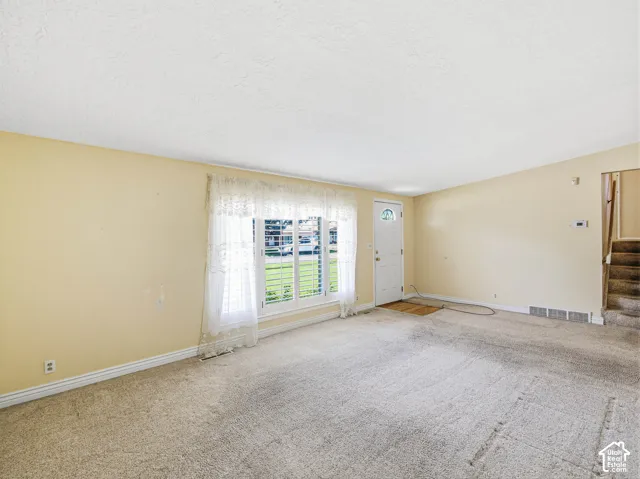 Entry space with a white paneled door and frosted glass insert