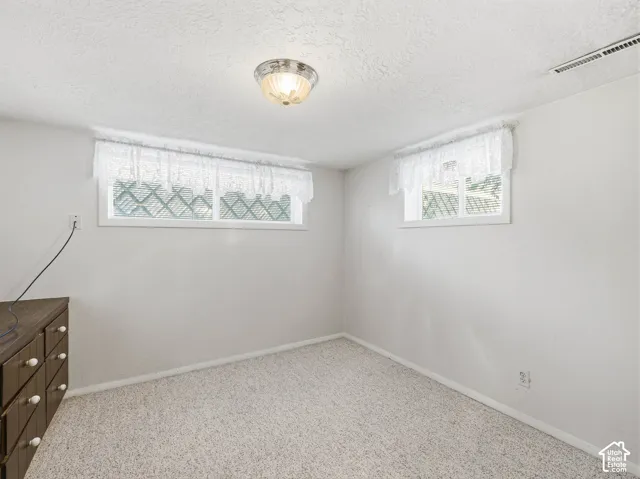 Wall-to-wall carpeting and white walls - 4th bedroom