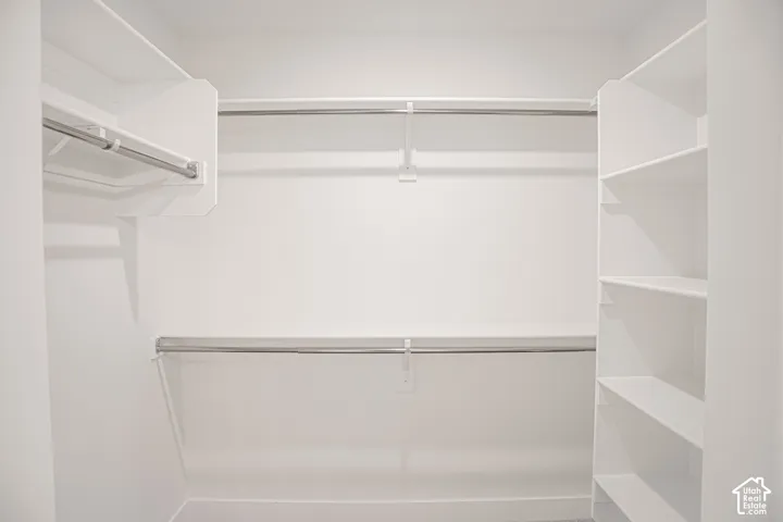 Large walk-in closet as part of primary suite.