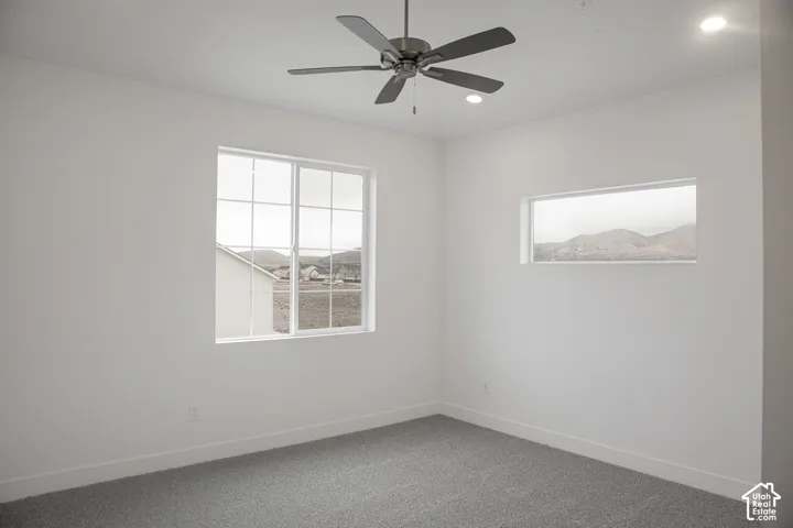 Primary bedroom with 9' ceiling and ceiling fan.