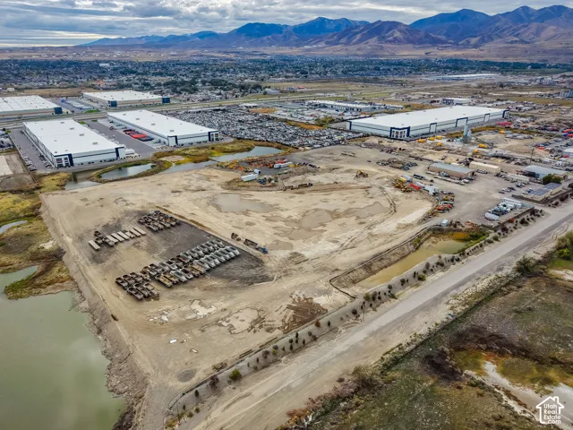 Expansive unimproved acreage featuring water frontage and a backdrop of mountain terrain