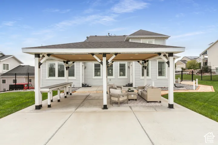 Covered outdoor pavilion featuring a built-in counter, recessed lighting, concrete patio flooring, and exposed structural support beams
