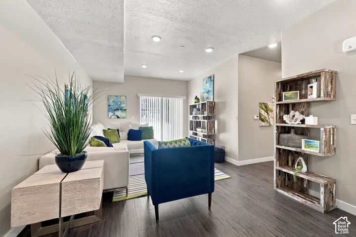 Interior space featuring wood-finish flooring, recessed lighting, and vertical blinds