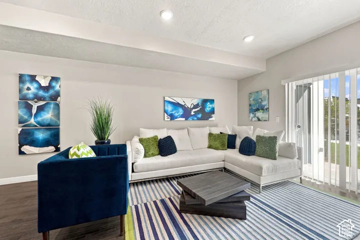 Neutral wall color, wood-finish flooring, recessed lighting, and sliding glass doors