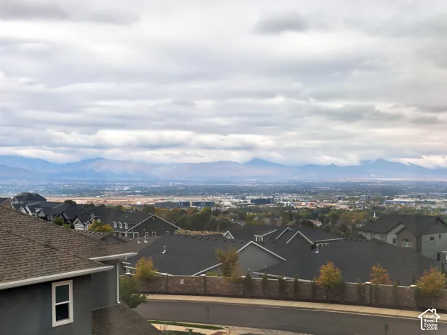 Elevated horizon featuring expansive mountain ranges and valley topography