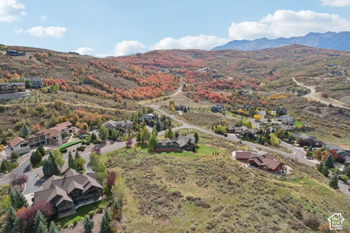 Mountainous landscape with expansive hillsides and established residential properties